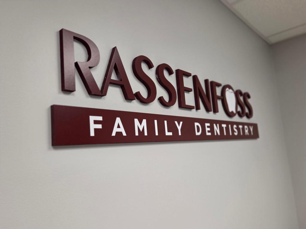 Rassenfoss Family Dentistry logo wall