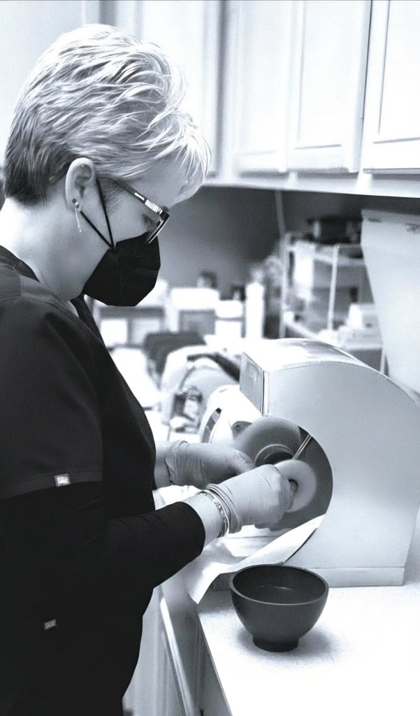Dentist performing dental procedure